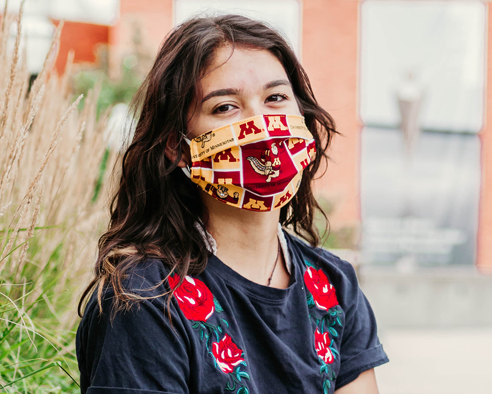 girl wearing mask on campus