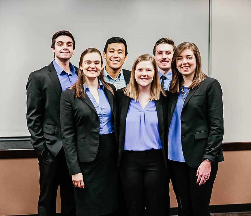 students wearing business professional attire